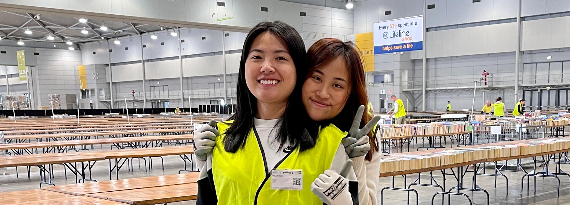 2 lifeline bookfest volunteers smiling