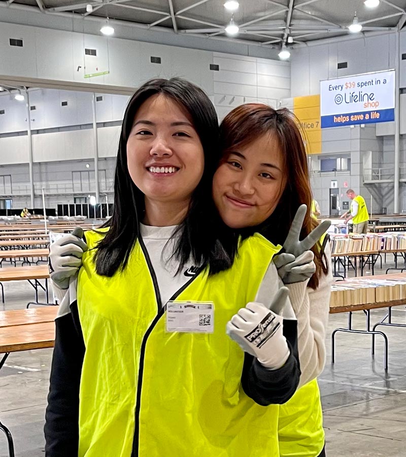 2 lifeline bookfest volunteers smiling
