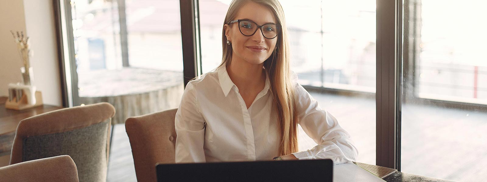 A woman with a laptop in the workplace