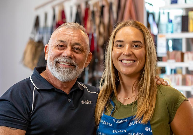 2 Lifeline workers smiling in a Lifeline shop